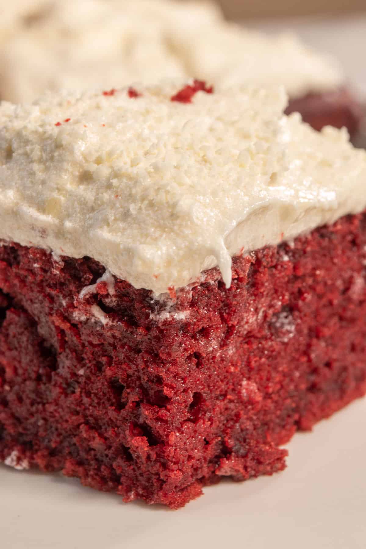 A soft vegan red velvet bar on a white plate. 