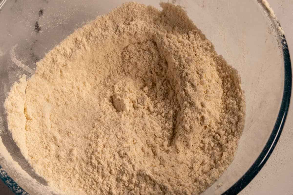 The dry cake ingredients combined inside a large, pyrex bowl. 
