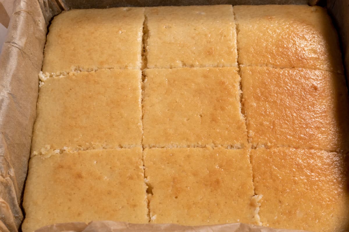 The cake has been sliced into 9 equal squares.