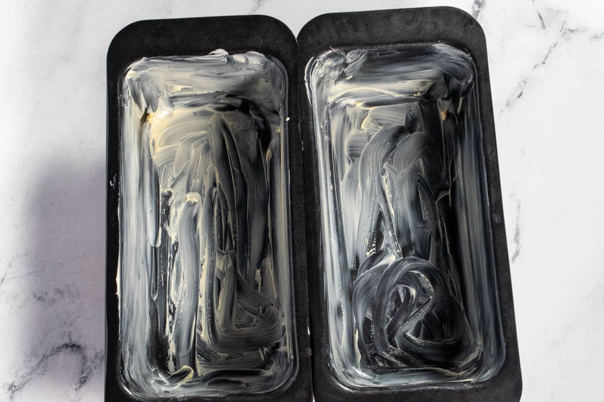 Two greased loaf cake tins. 