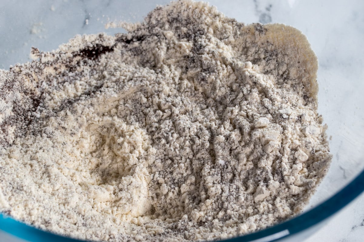 The dry ingredients mixed together inside a large, glass bowl.
