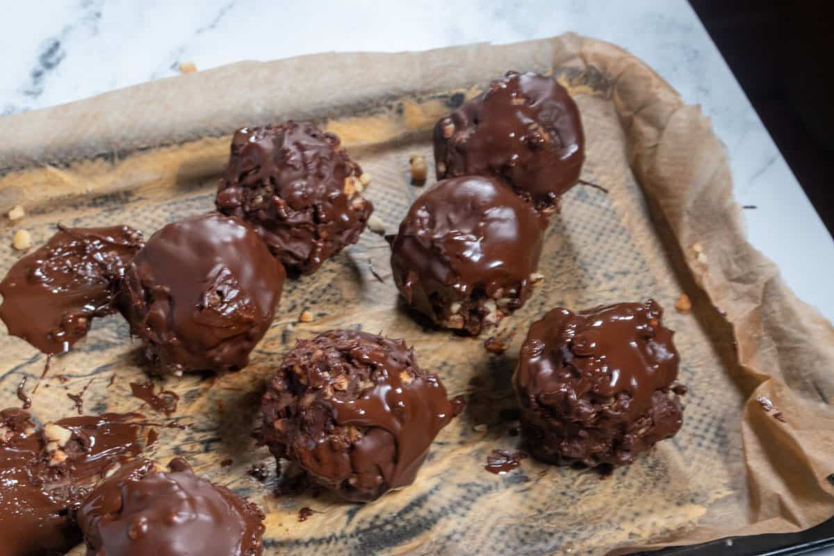 The balls have now been dipped in extra chocolate creating vegan ferrero rocher truffles.
