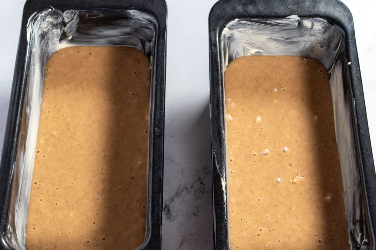 The batter has been poured into the loaf cake tins.