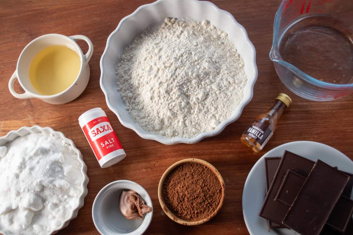 The ingredients needed to make my easy double fudge brownies laid out neatly over a wooden background. 