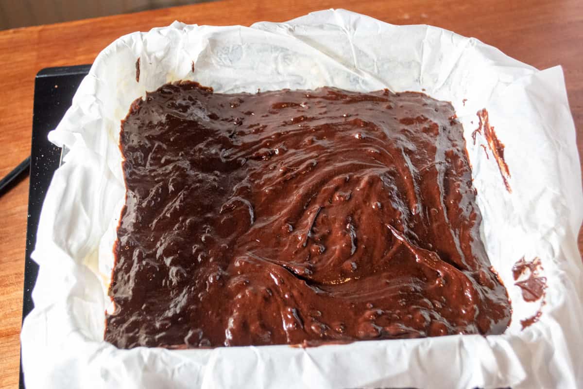 The chocolatey batter has been poured into the tin. 